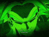 a close up of a person 's face with a green background