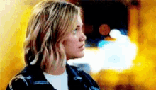 a close up of a woman 's face with a blurry background