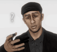 a man holding a cell phone with a question mark above his head