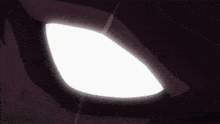 a close up of a person 's mouth with teeth and a glowing eye