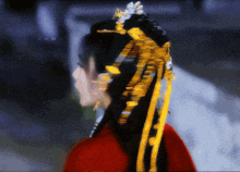 a blurry picture of a woman wearing a red dress