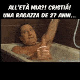 a man in a bathtub with the caption " all ' eta mia "