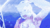 a woman wearing a white cat mask is dancing