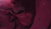 a close up of a purple object with the word gifs on the bottom right