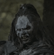 a close up of a person with a gray face