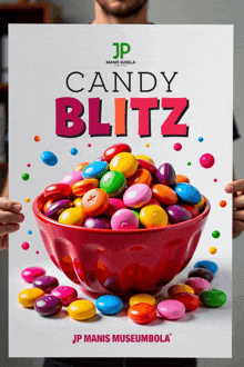 a man holding a poster for candy blitz