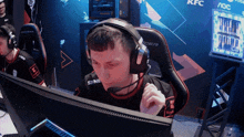 a man wearing headphones and a shirt that says syner on it