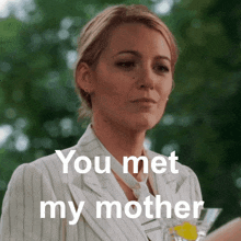a woman in a suit and tie says " you met my mother "