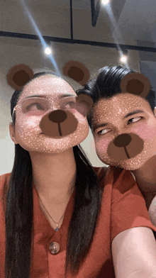 a man and a woman wearing teddy bear masks
