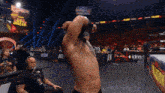 a man in a wrestling ring with a sign that says " ready break "