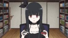 a girl with black hair and red eyes is holding two toy cars