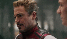 robert downey jr. is playing iron man in avengers : endgame and talking to another man .