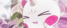 a cartoon cat with horns and pink spots on its face