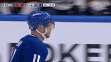 a hockey player wearing a blue oreo helmet