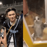 a man wearing a jersey that says ' o'trako ' on it is taking a picture of a cat