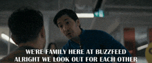 a man talking to another man with the words " we 're family here at buzzfeed alright we look out for each other "