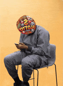 a man wearing a hat that says otto13 looks at his phone