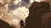 a man is standing on top of a pile of dirt .