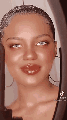 a close up of a woman 's face with tiktok written on the bottom right corner