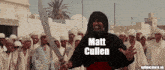a man holding a sword in front of a crowd with matt cullen written below him