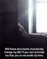 a person 's hand is reaching out towards a window with empty-dream written below it