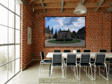a room with a brick wall and a picture on the wall that says fine woensdag