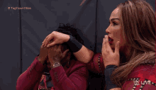 a woman covering a man 's face with her hand and the words tag team titles in the corner