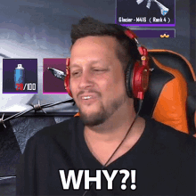 a man wearing headphones is making a funny face while sitting in a chair .