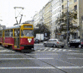 a red and yellow trolley with the number 18 on the front of it