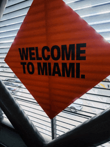 a red sign that says welcome to miami