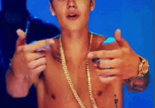 justin bieber pointing bling smiling happy