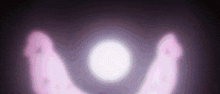 a pink horseshoe is glowing in the dark with a white light in the middle .