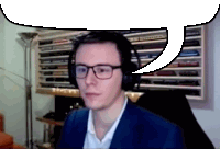 a man wearing glasses and headphones with a speech bubble above his head