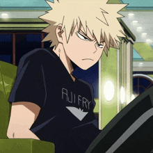 a boy with a t-shirt that says aji fry