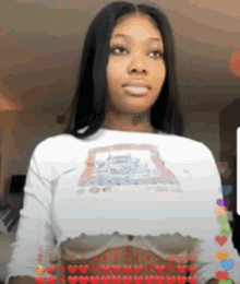 a woman is wearing a white crop top with a picture of a dog on it .