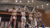 a group of women in a wrestling ring with the word stardom on the top
