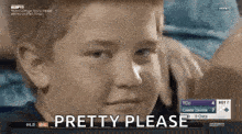 a young boy is making a funny face and saying pretty please .
