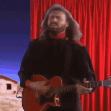 playing guitar barry gibb bee gees when hes gone song gone to the clouds