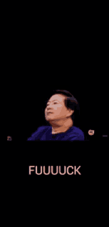 a man in a blue shirt is making a funny face and the words fuuuuck are below him
