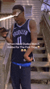 a man wearing a brooklyn jersey is standing on stairs