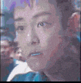 a pixelated image of a person 's face with a purple background