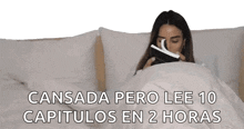 a woman is laying in bed reading a book with the words cansada pero lee 10 capitulos en 2 horas below her