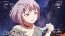 a video of a girl with purple hair is being recorded