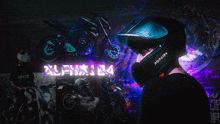 a man wearing a helmet that says alpha184