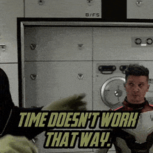 a man standing in front of a washing machine with the words time does n't work that way