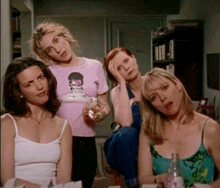 a woman in a pink t-shirt with a skull on it