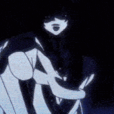 a man and a woman are dancing together in a dark room .