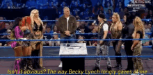 a group of women are standing in a wrestling ring and one of them says ' isn 't it obvious '