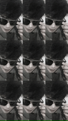 a black and white photo of a man wearing sunglasses