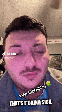 a man with a mustache is making a funny face with the words tw gagging that 's fucking sick